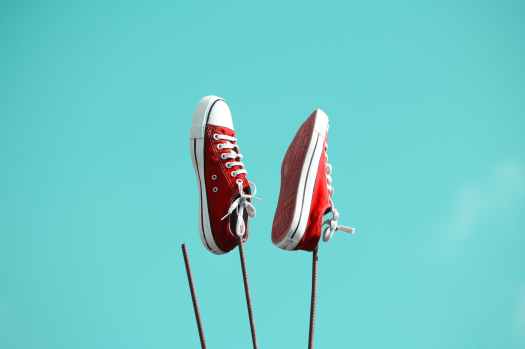 pair of red and white low top sneakers